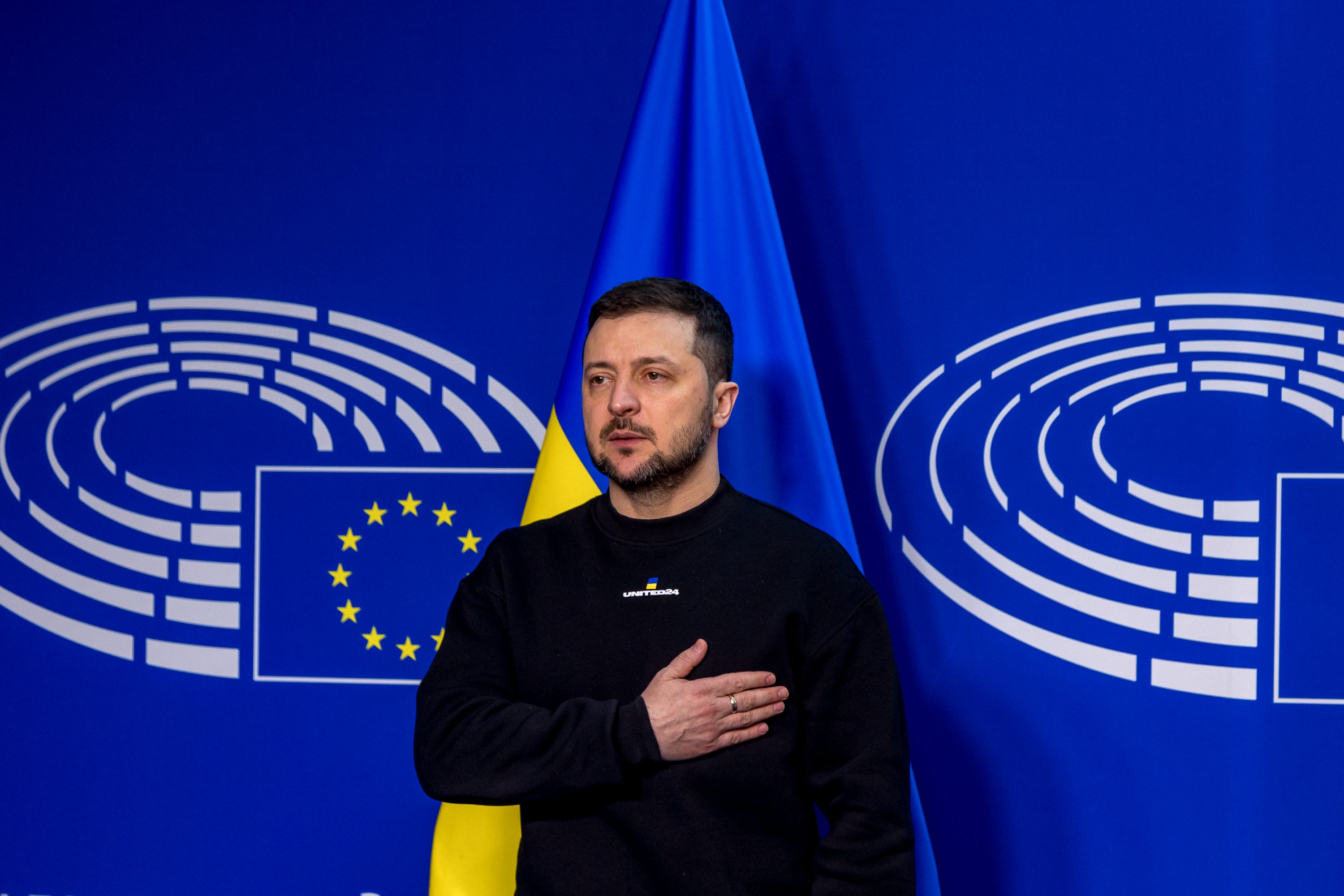 Ukrainian President Volodymyr Zelensky stands in Brussels
