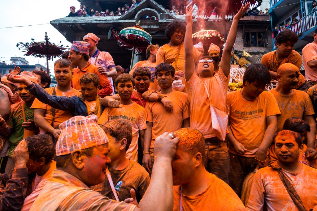 A group of devotees throw vermillion powder in Nepal