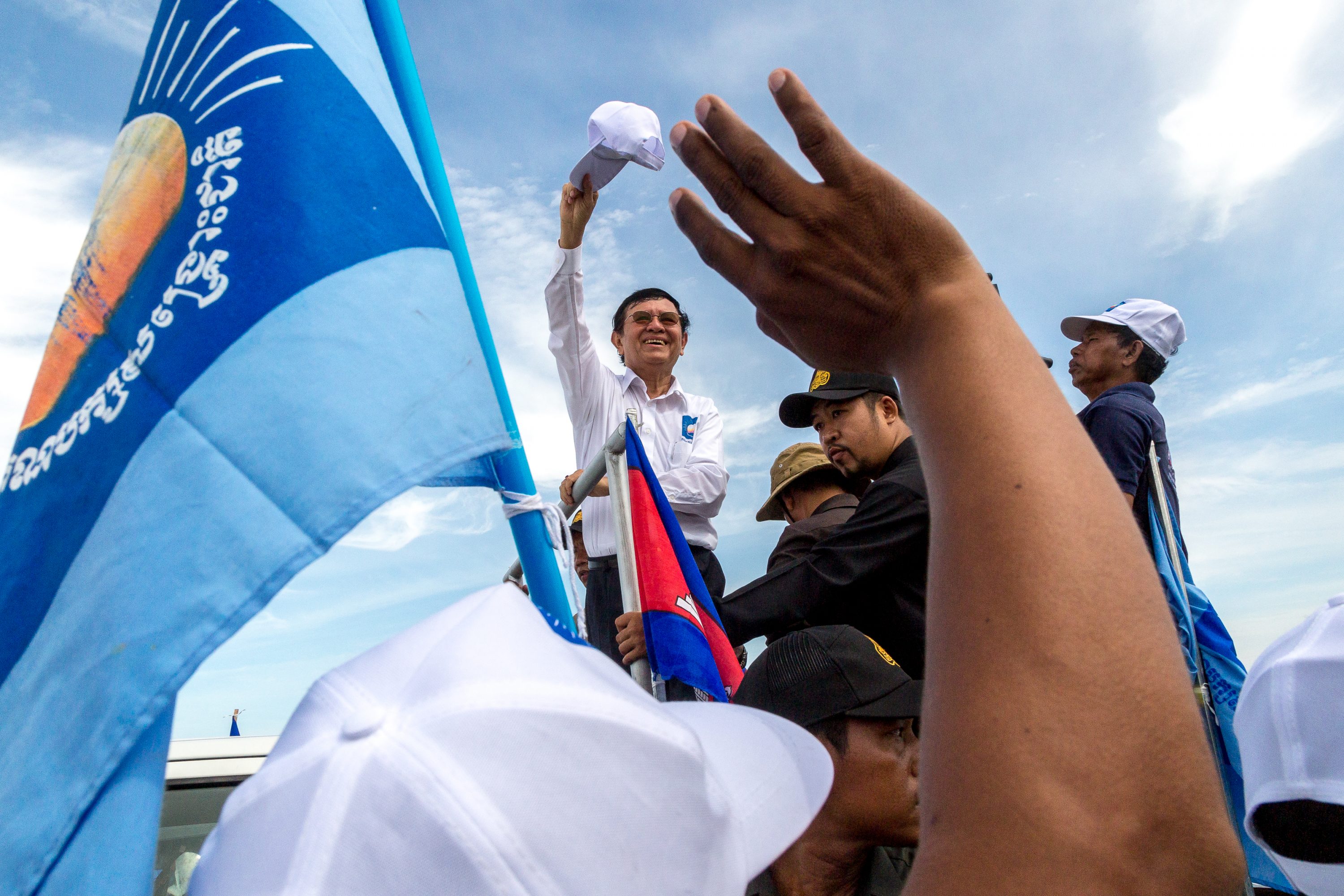 Kem Sokha, the president of the opposition Cambodia National Rescue Party, waves to the crowd in Cambodia
