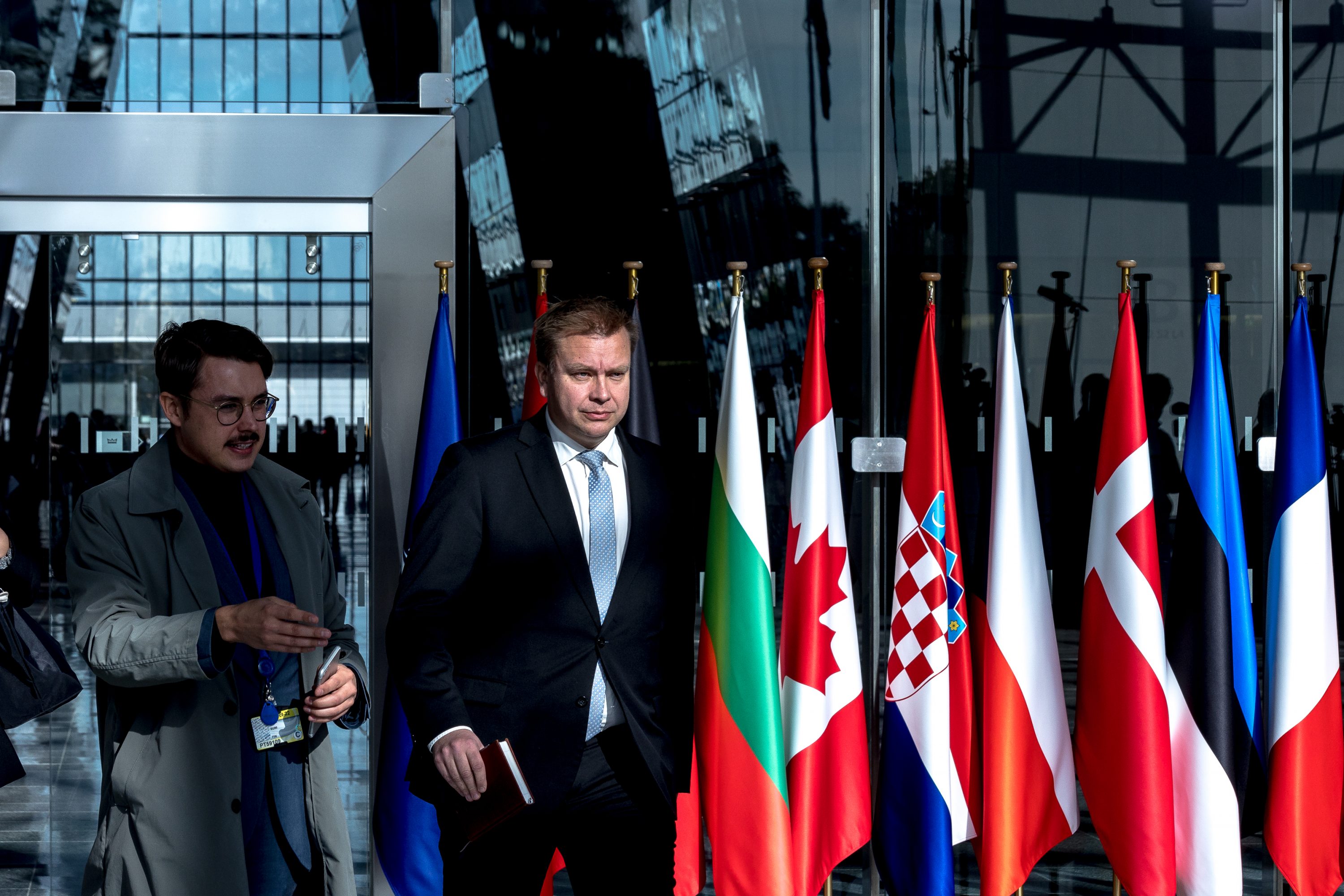 Finnish Defence Minister Antti Kaikkonen walks to a press conference in Brussels