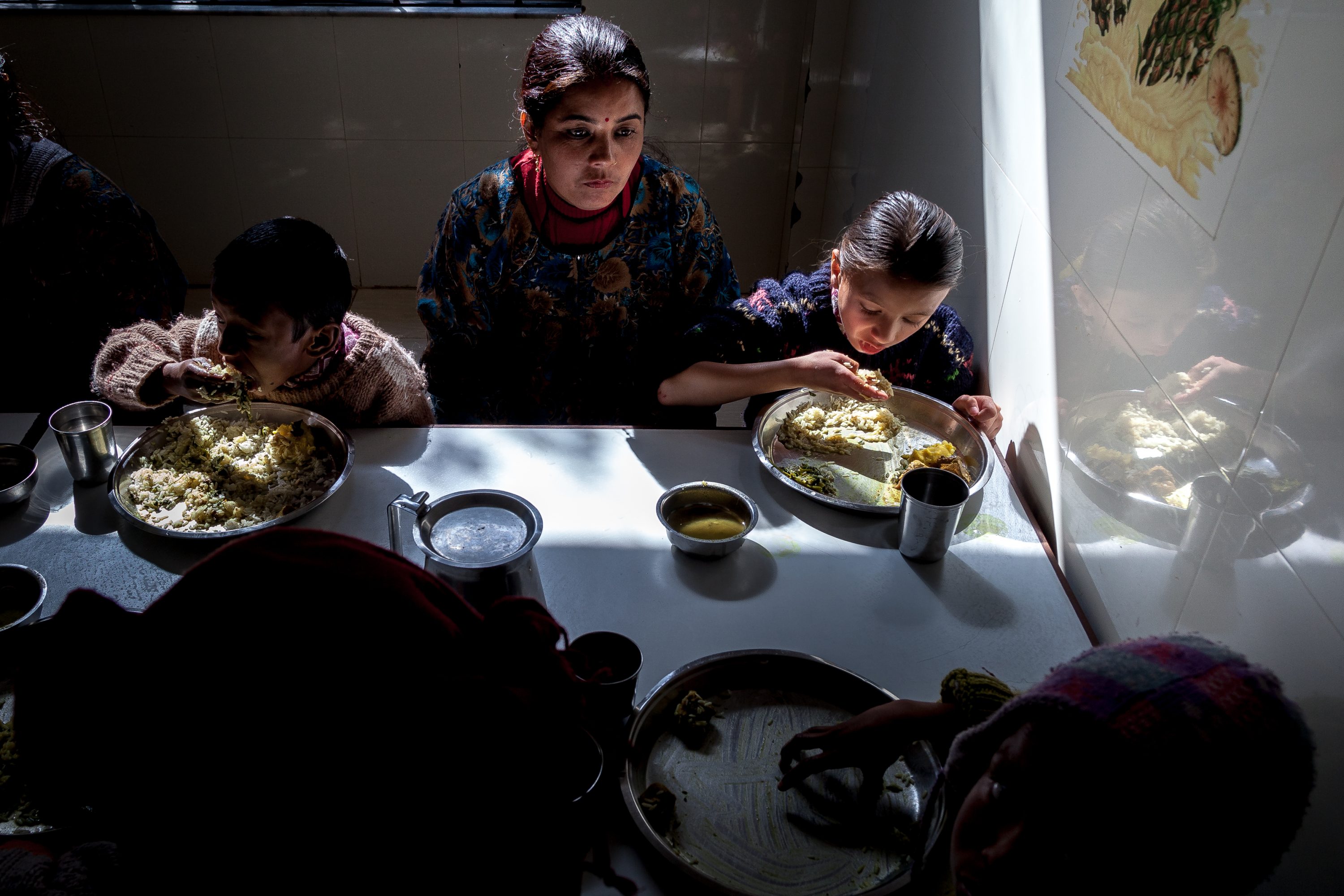 AGRICULTURE AND FOOD PORTFOLIO A group of mothers and children have lunch in Nepal