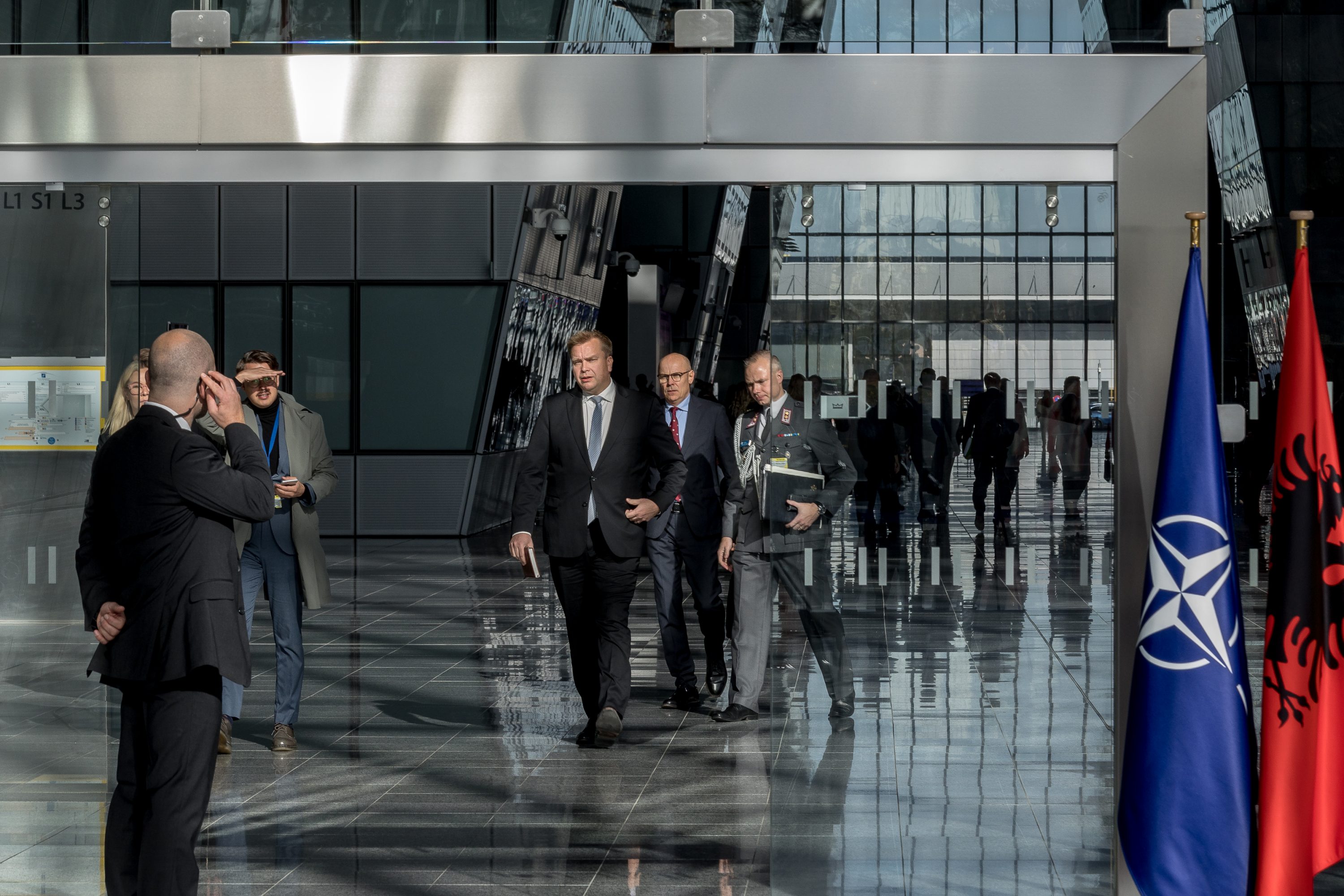Finnish Defence Minister Antti Kaikkonen walks to a press conference in Brussels