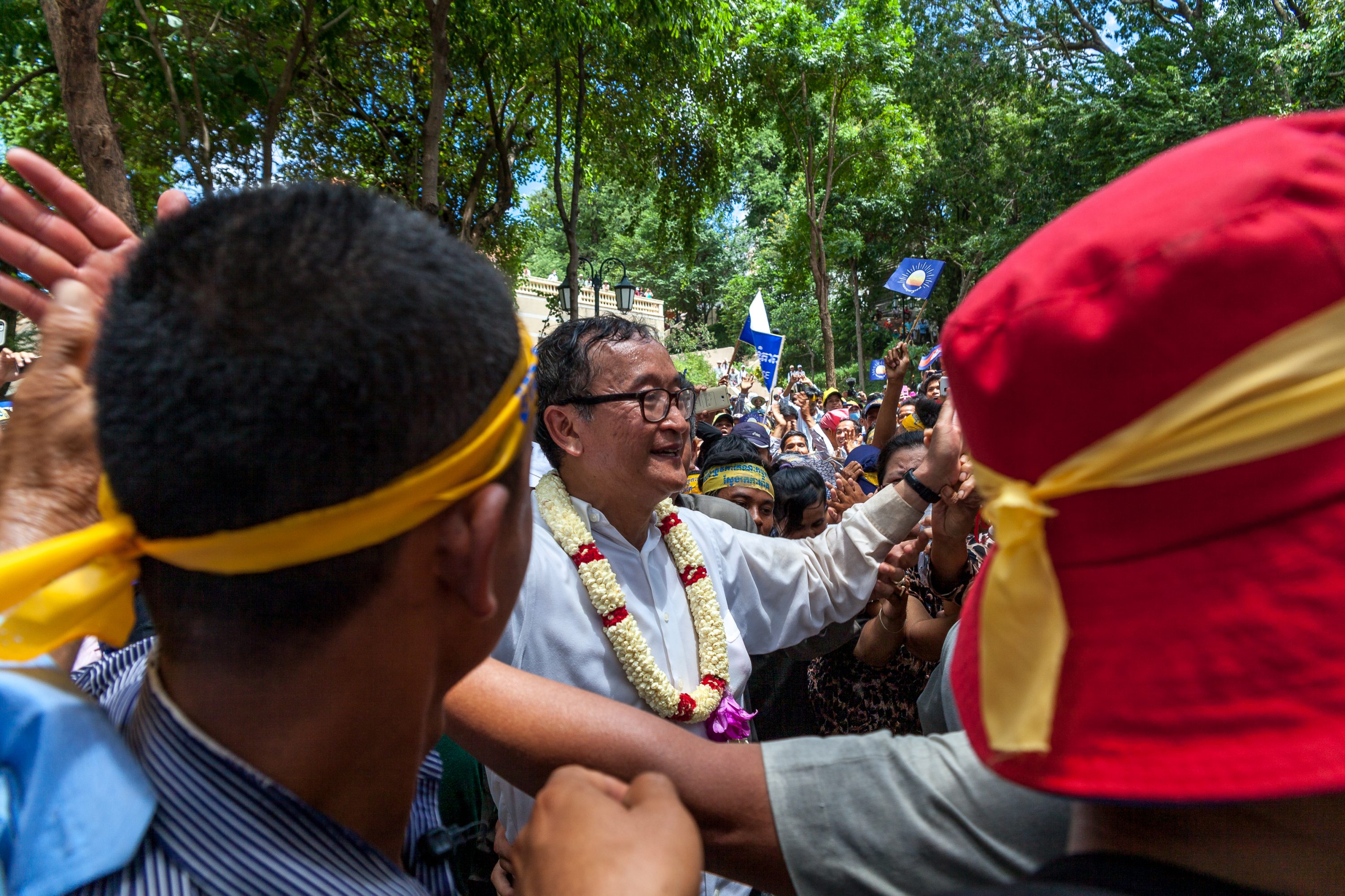 Sam Rainsy is greeted by dozens of fervent supporters in Cambodia