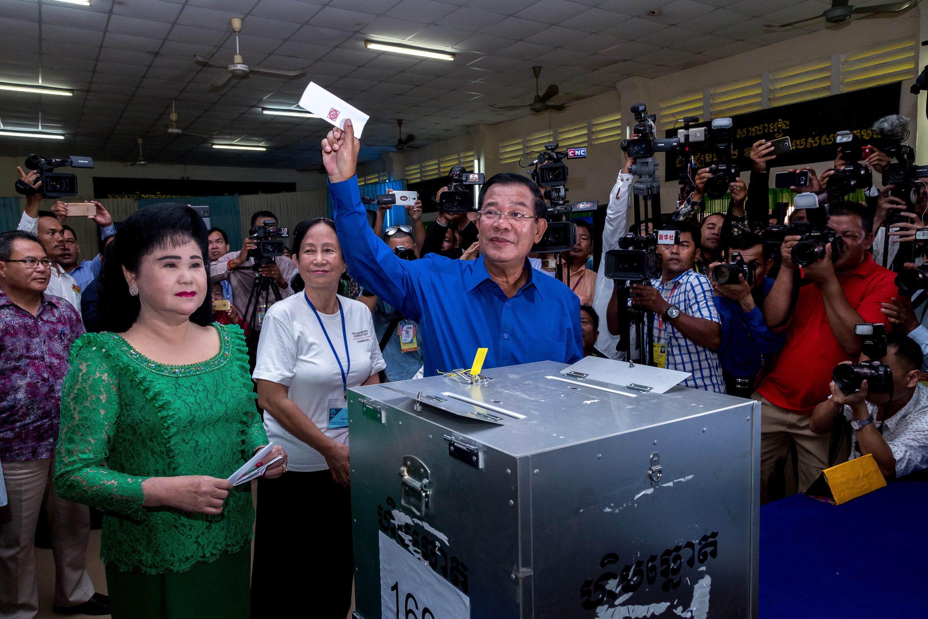 Prime Minister Samdech Hun Sen shows his ballot to the press in Cambodia