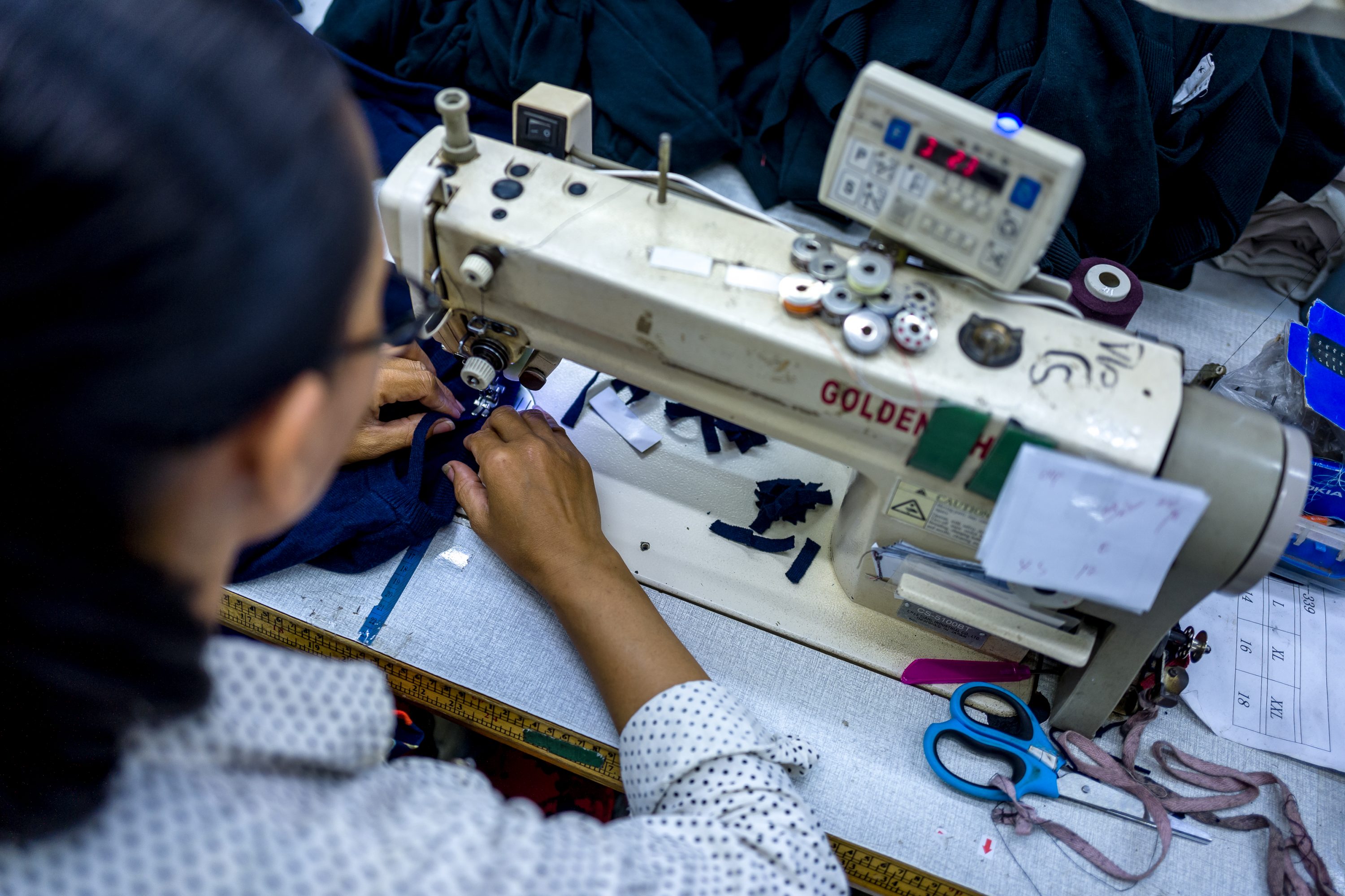Employees of a textile factory make garments in Cambodia
