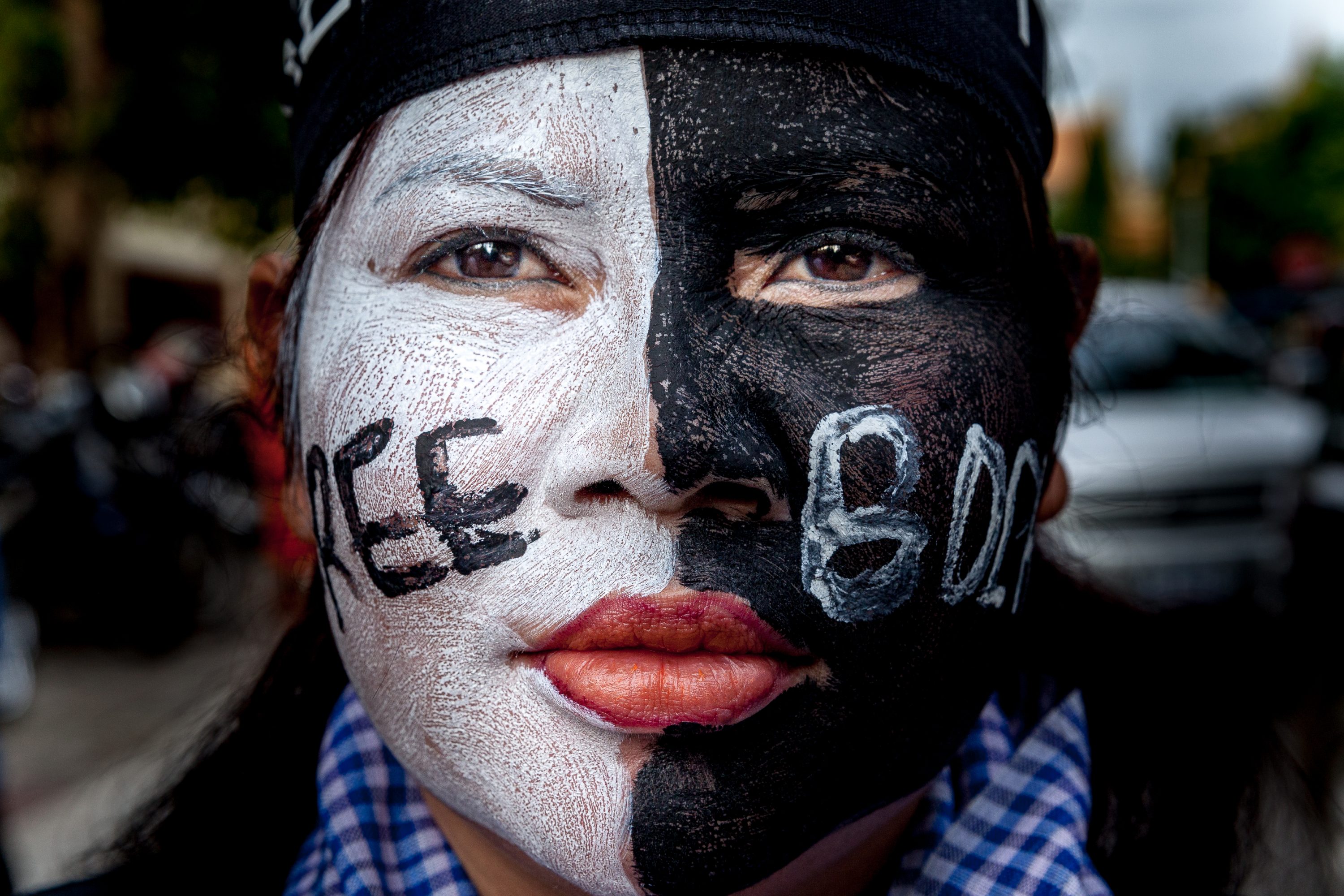 Boeung Kak Lake activist Bo Chhorvy stands by the Supreme Court in Cambodia