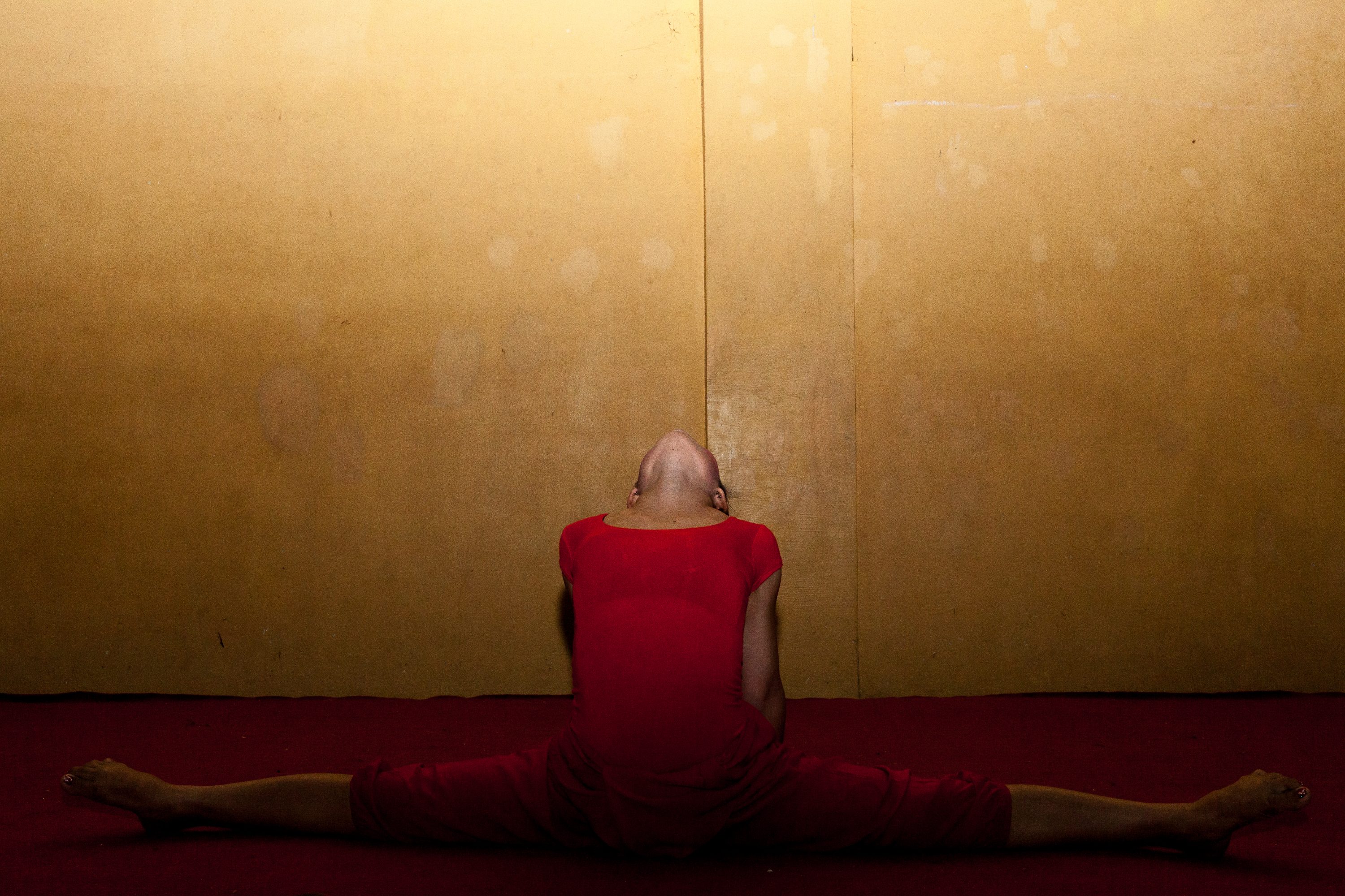 A young contortionist of the Phare Ponleu Selpak circus stretches in Cambodia
