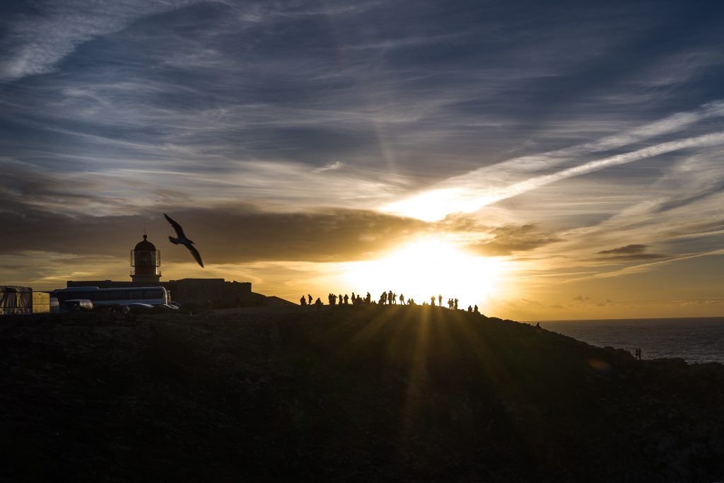 Tourists watch the sunset in Portugal