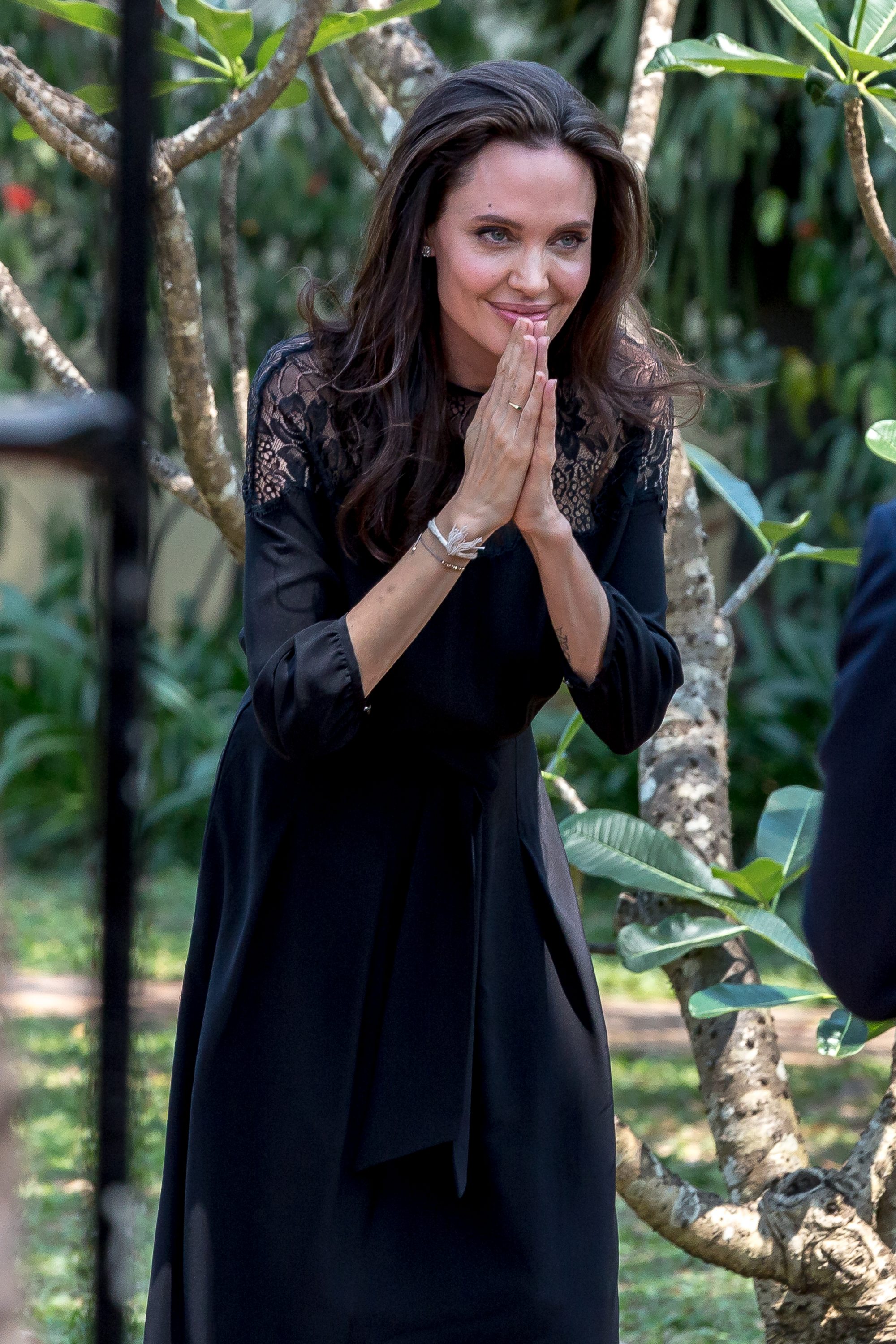 Angelina Jolie leaves a press conference in Cambodia