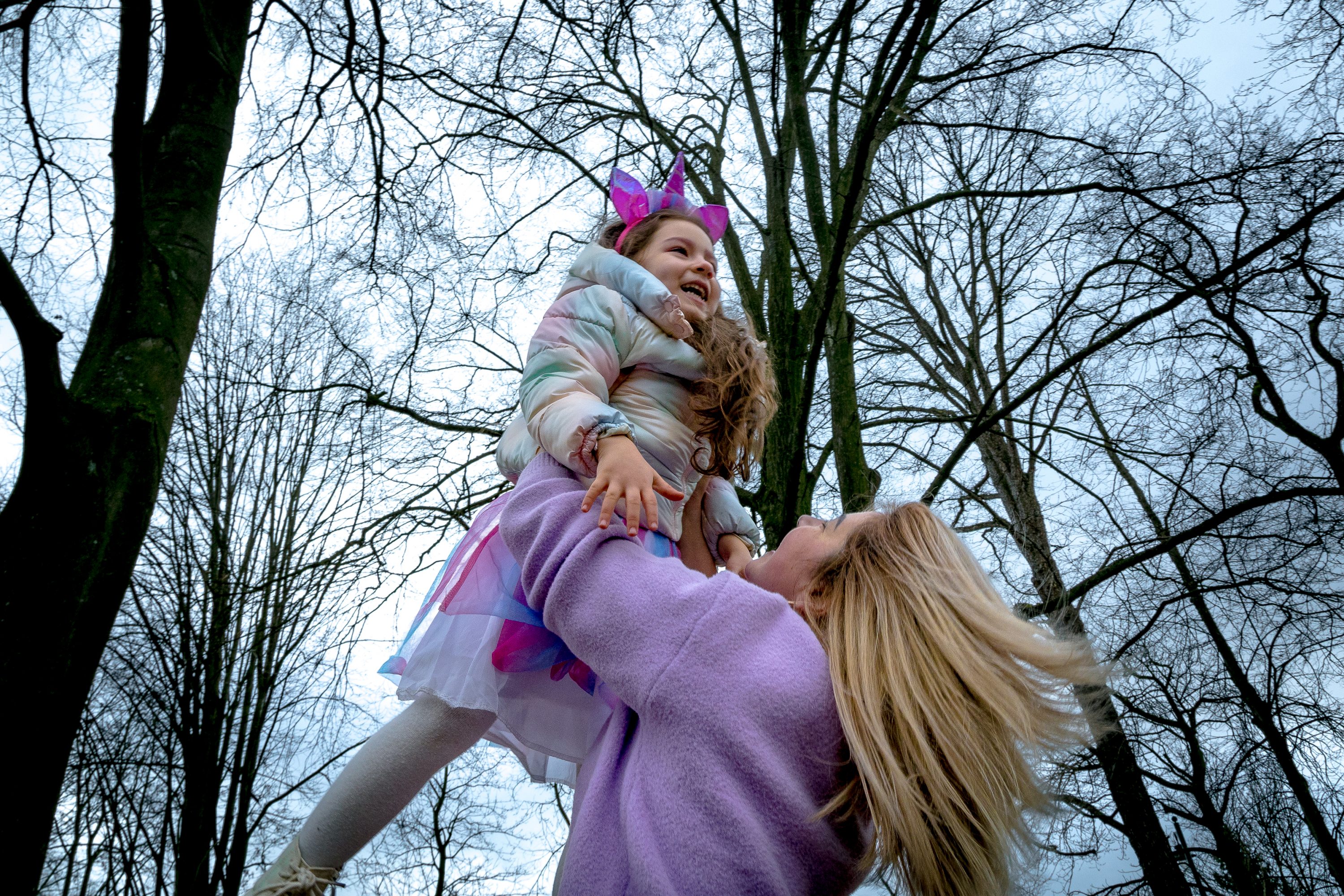 Antonina plays with her daughter Angelina in Brussels