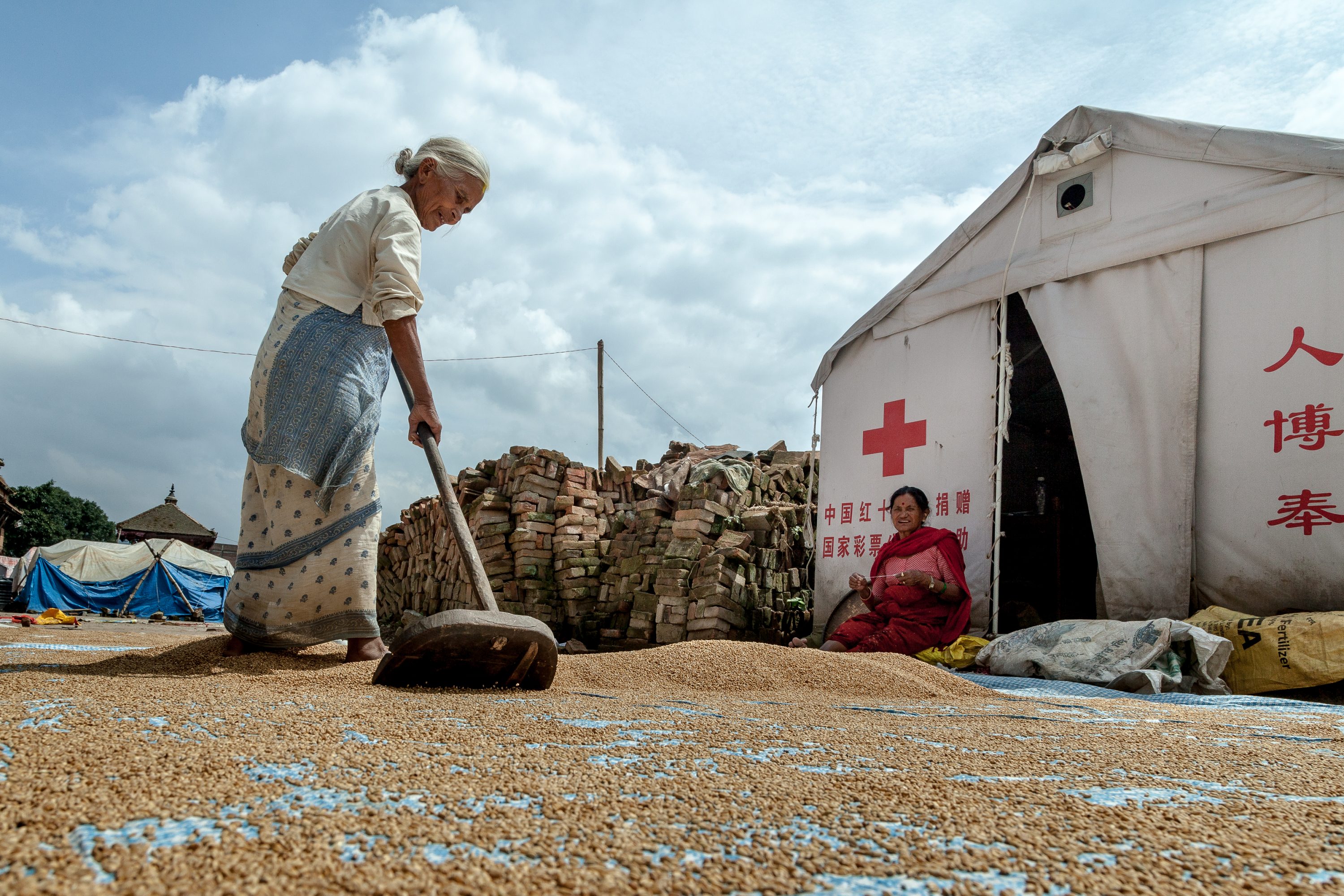 AGRICULTURE AND FOOD PORTFOLIO A woman cleans grains in Nepal