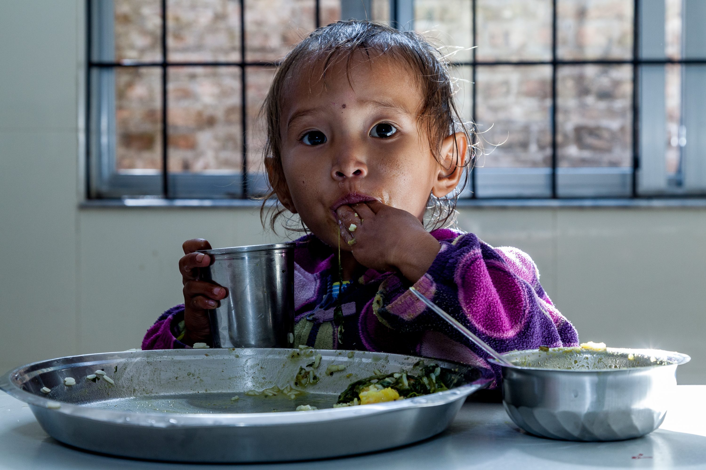 AGRICULTURE AND FOOD PORTFOLIO A young girl has lunch in Nepal