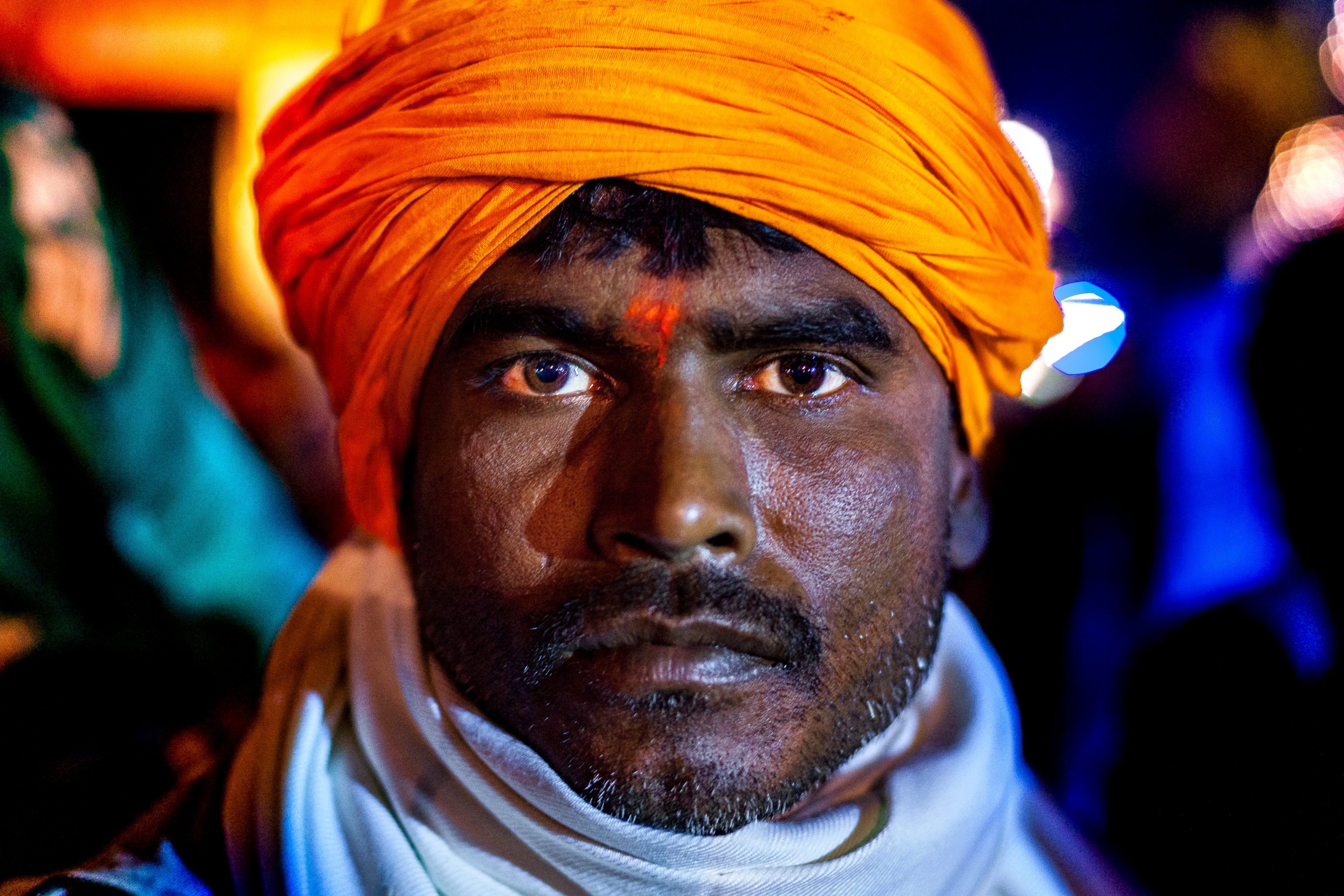 A devotee poses in front of the temple in Nepal