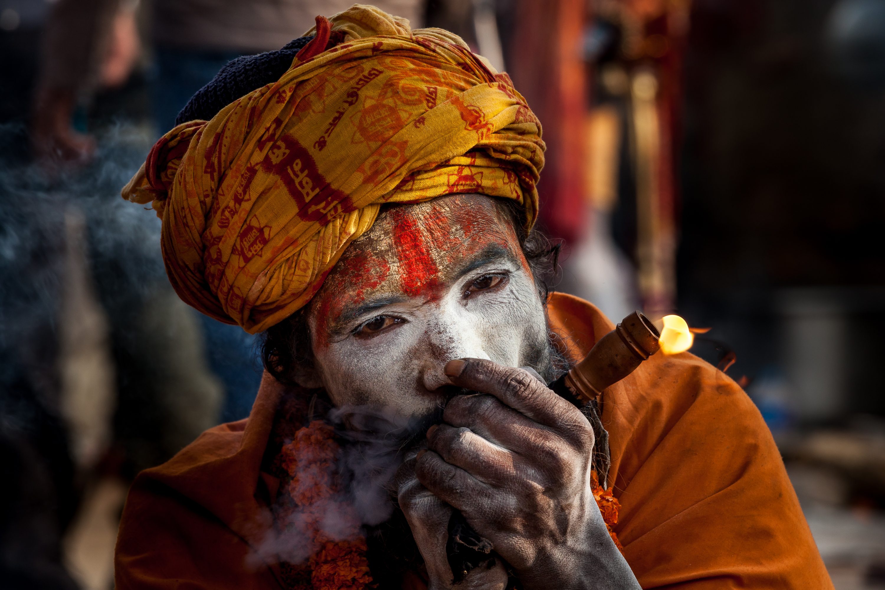 A Shadu, or holy man, smokes cannabis in Nepal