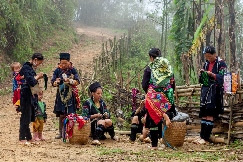 A group of Hmong women wait for tourists hiking in Vietnam