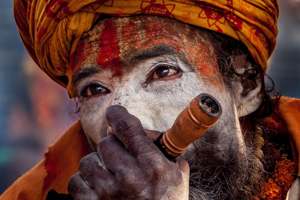 A Shadu, or holy man, smokes cannabis in Nepal