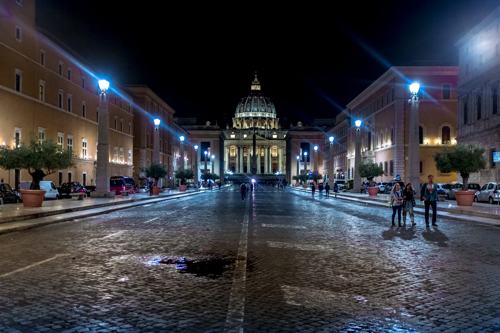 Tourists walk along Via della Conciliazione in the Vatican