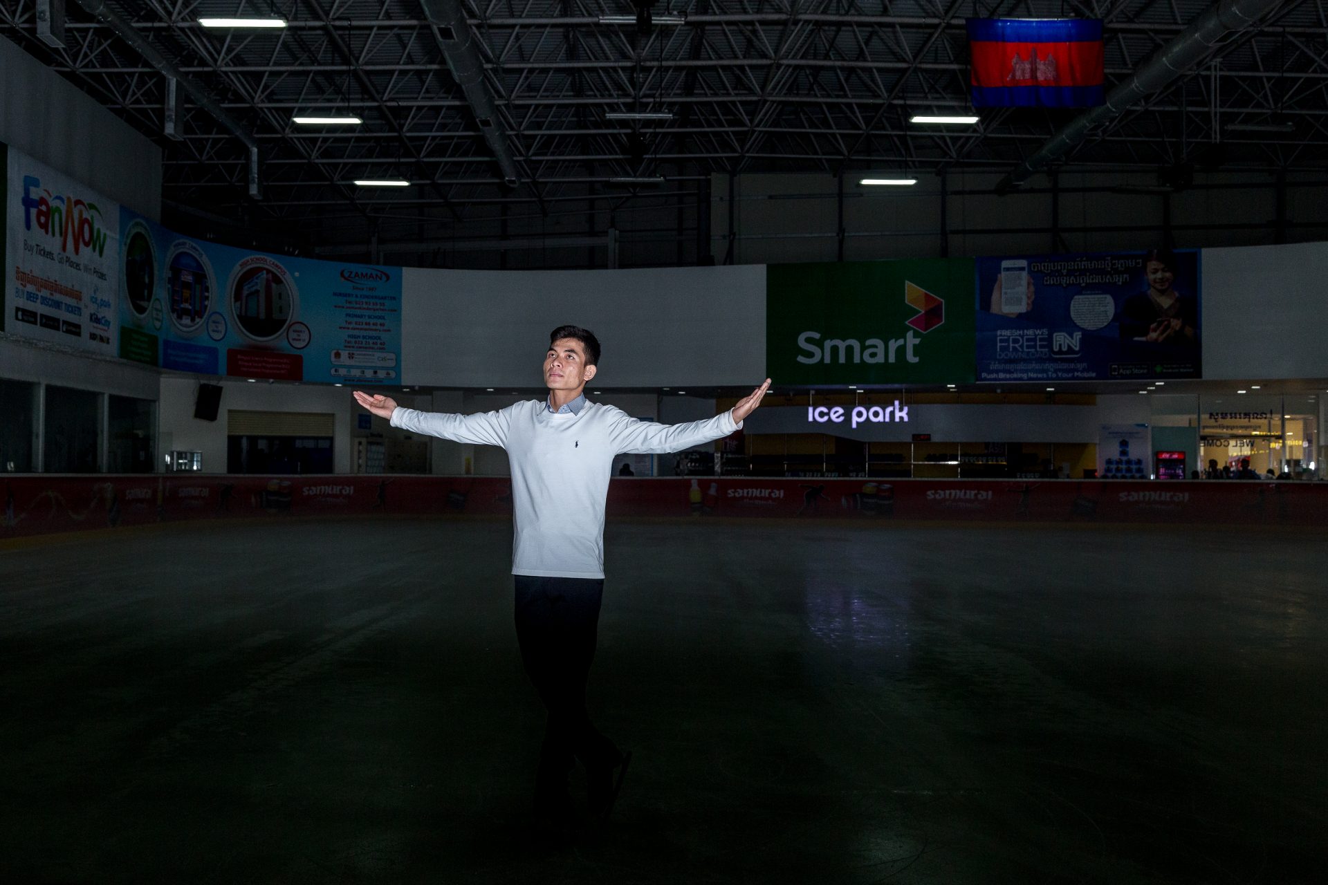 23-year-old Khiev Panha poses for a photo inside the Aeon Mall Ice Rink in Cambodia