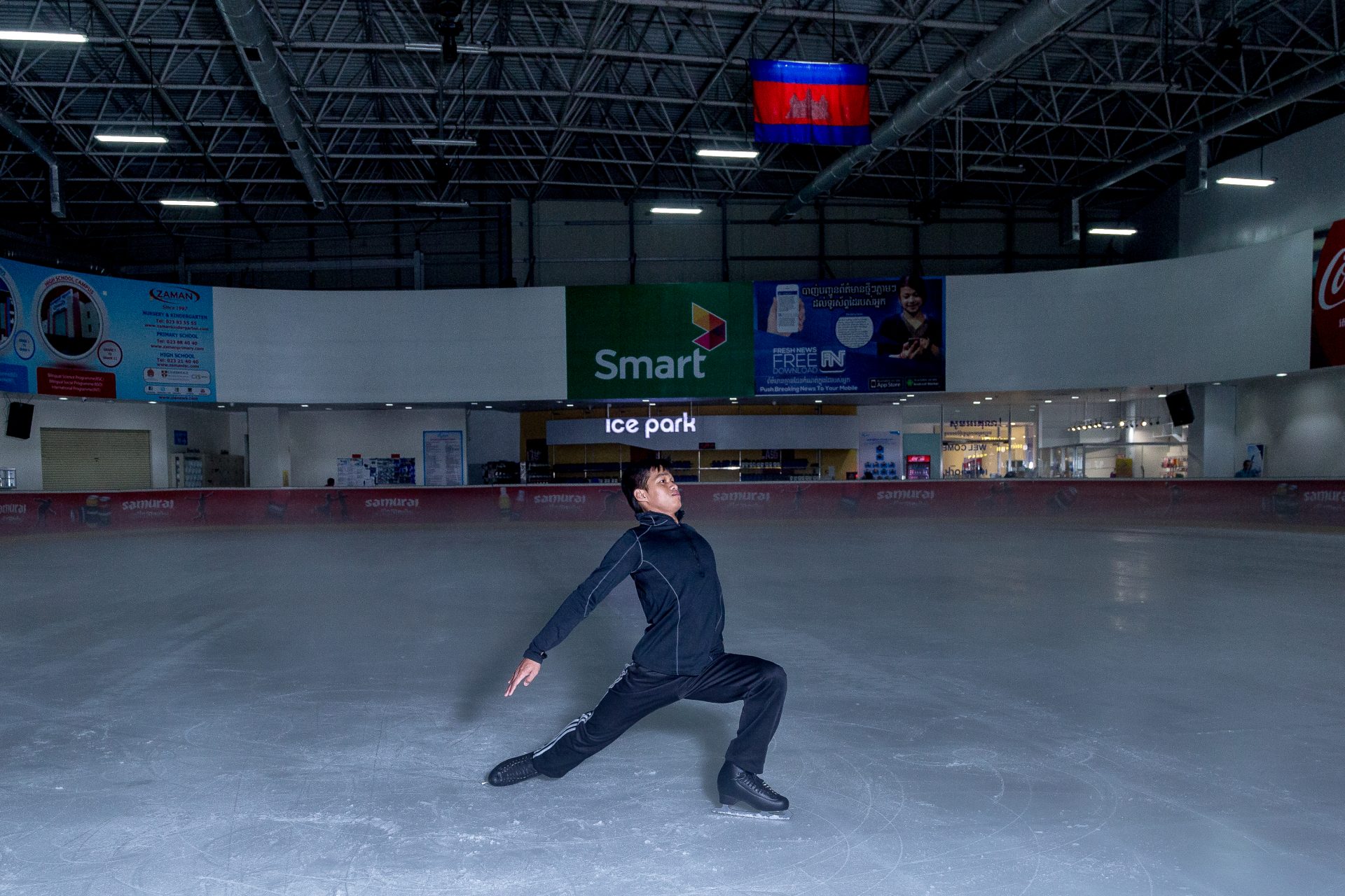 27-year-old Sen Bunthoeurn poses for a photo inside the Aeon Mall Ice Rink in Cambodia